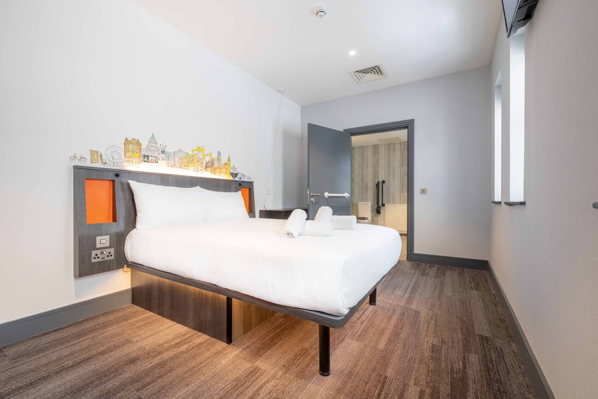 EasyHotel Belfast Accessible Double room with double bed, white linens, and accessible features.