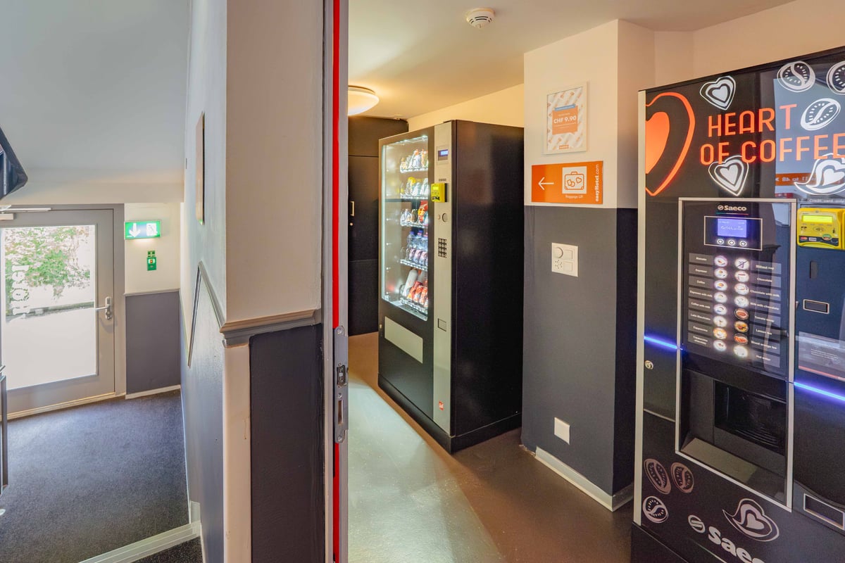 EasyHotel Zurich City Centre reception area with a coffee machine and snack vending machine.