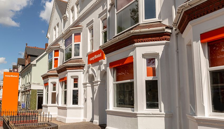 easyHotel Reading building exterior with white facade, bay windows, and prominent orange branding.