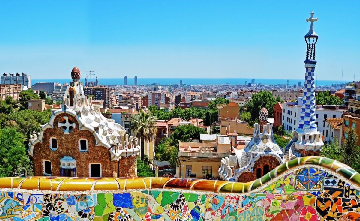 View of Barcelona city from one of the mosaic balconies, designed by Gaudi, in Park Guell in Spain. 