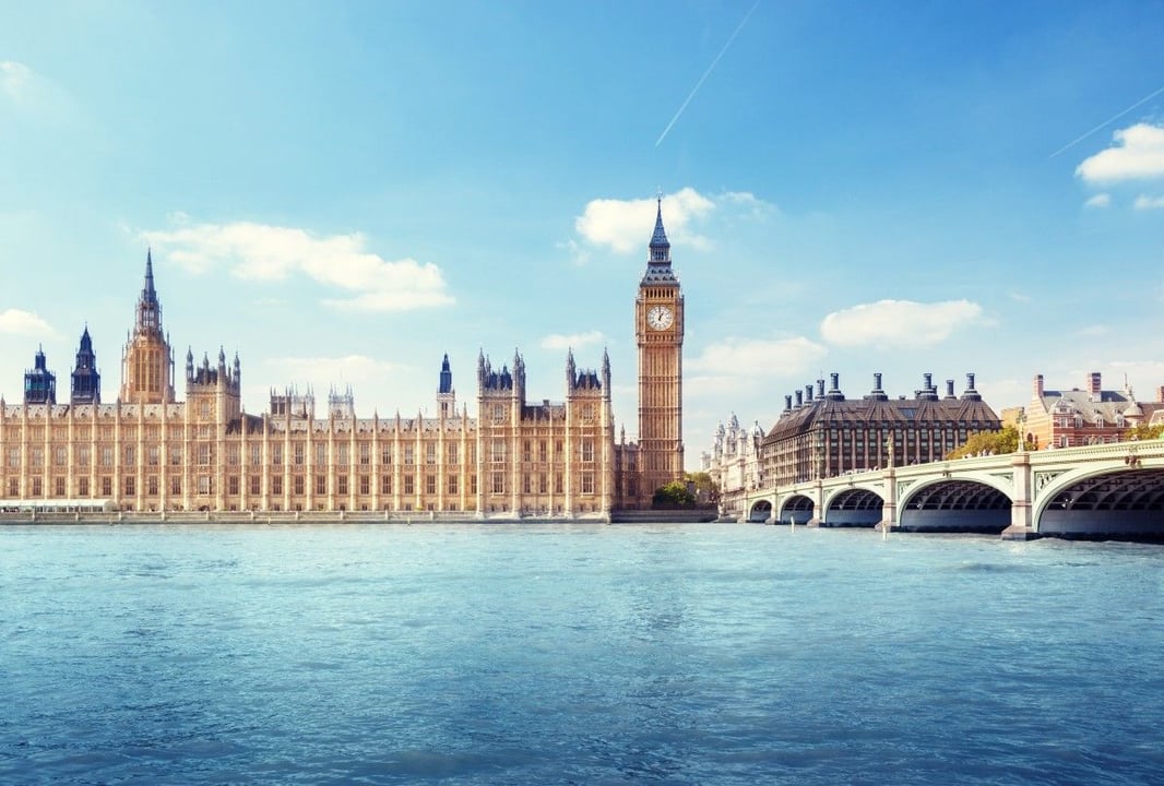 Big Ben and the Houses of Parliament / Palace of Westminster with the Westminster Bridge sat across the River Thames